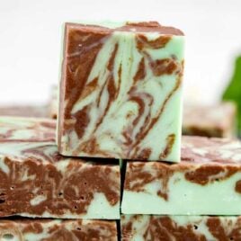 a close up shot of Mint Chocolate Fudge bars stacked on top of each other