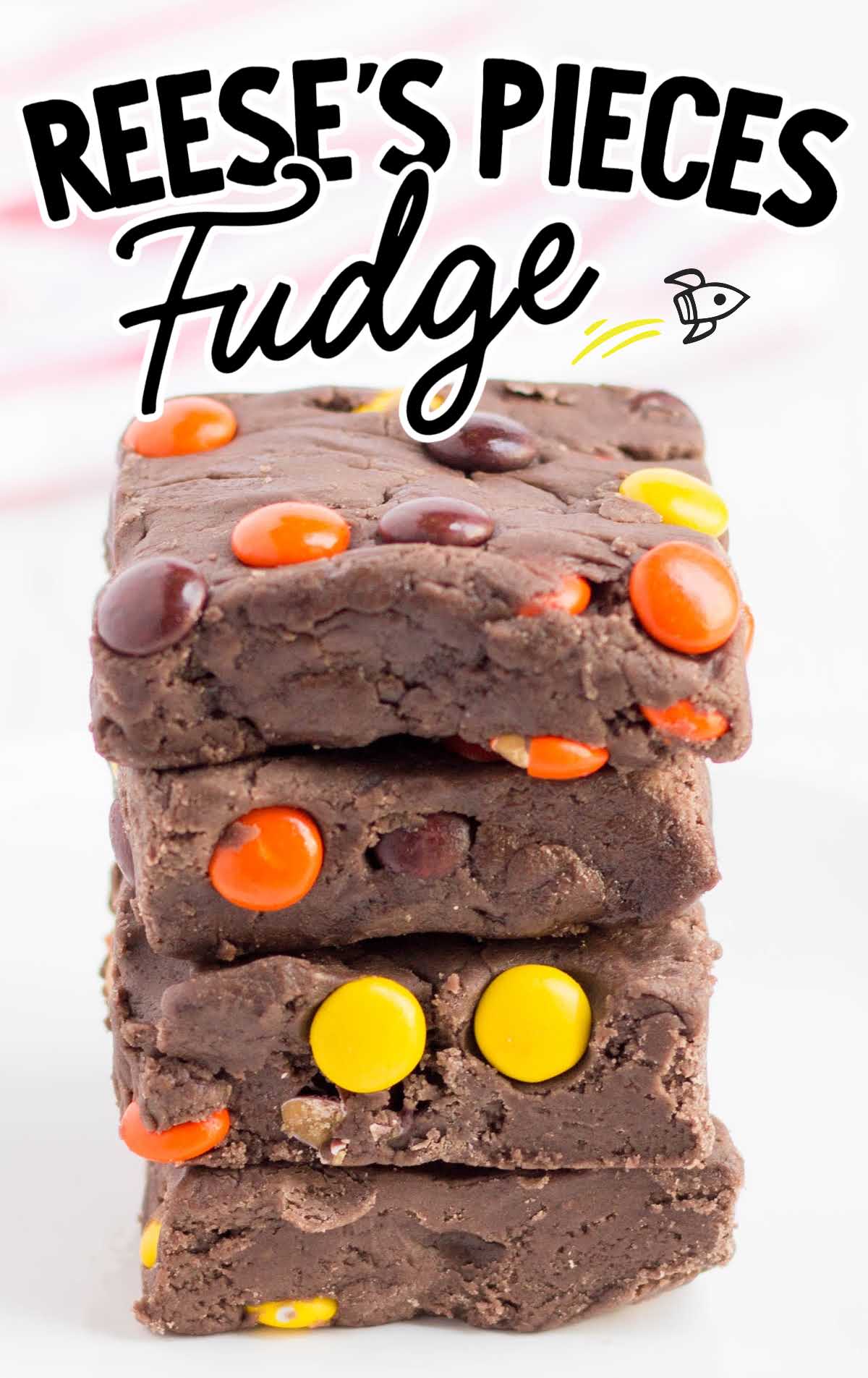 close up shot of Reese's Pieces Fudge stacked on top of each other