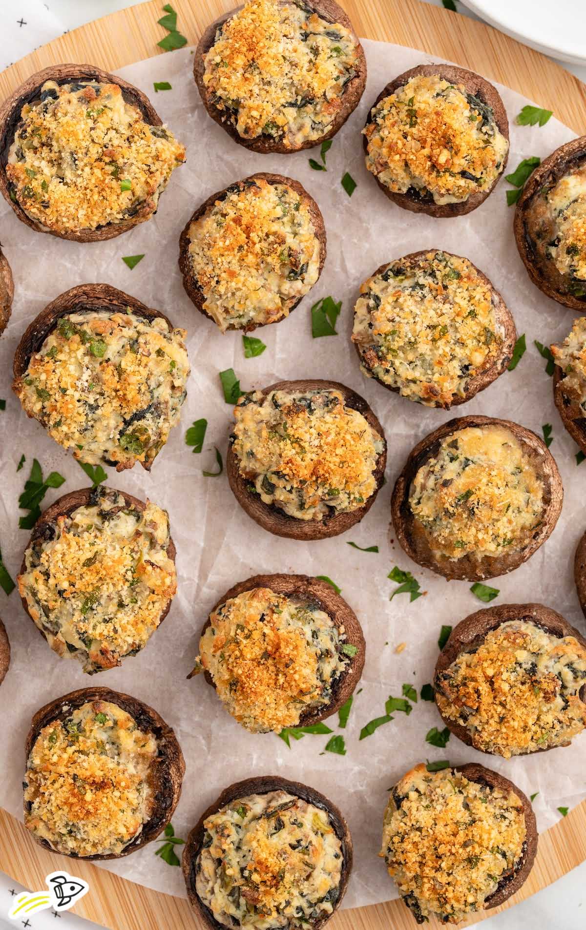 a bunch of Stuffed Mushrooms garnished with parsley