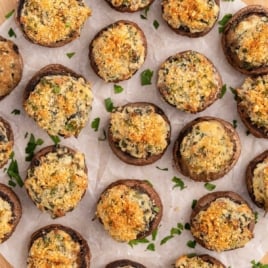 a bunch of Stuffed Mushrooms garnished with parsley