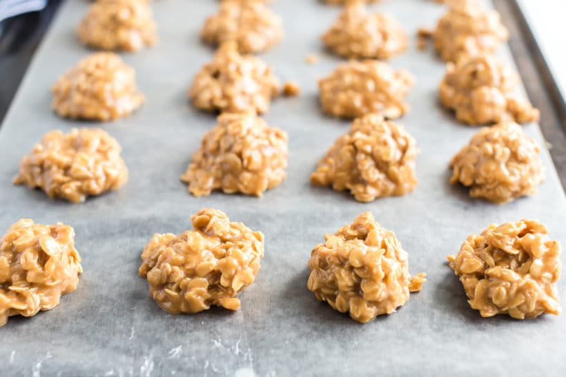 baking sheet with rows of peanut butter no bake cookies