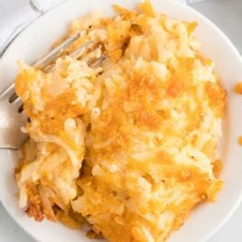 close up overhead shot of a serving of Cheesy Potato Casserole on a plate