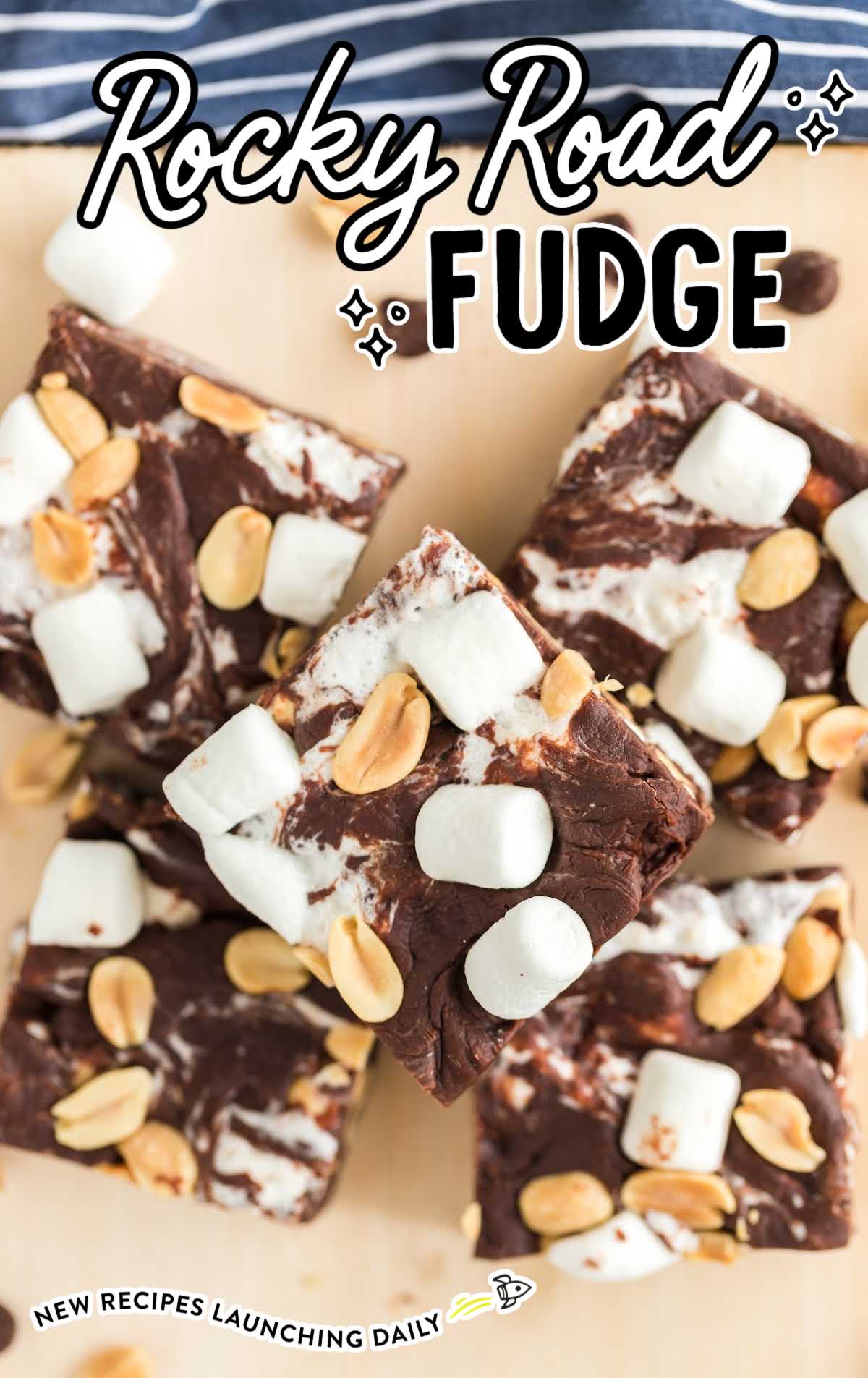 close up overhead shot of a bunch of Rocky Road Fudge on a wooden board