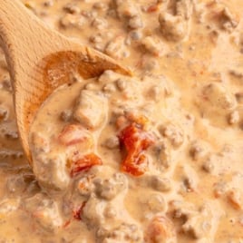 Labeled image of Rotel dip being stirred with a wooden spoon, promoting “Easiest 20-Minute Stovetop Rotel Dip.”