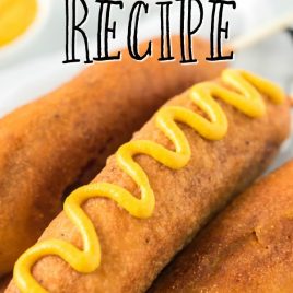 Corn dogs in a basket with mustard