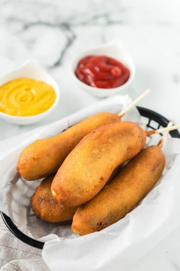 Food on a plate, with Corn dog and Sausage