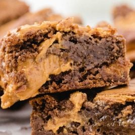 close up shot of peanut butter brownies stacked on top of each other