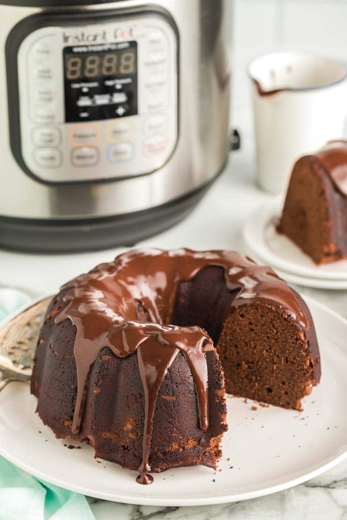 CHOCOLATE CAKE IN FRONT OF INSTANT POT