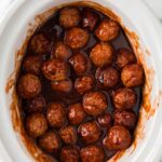 close up overhead shot of Grape Jelly Meatballs in a crockpot