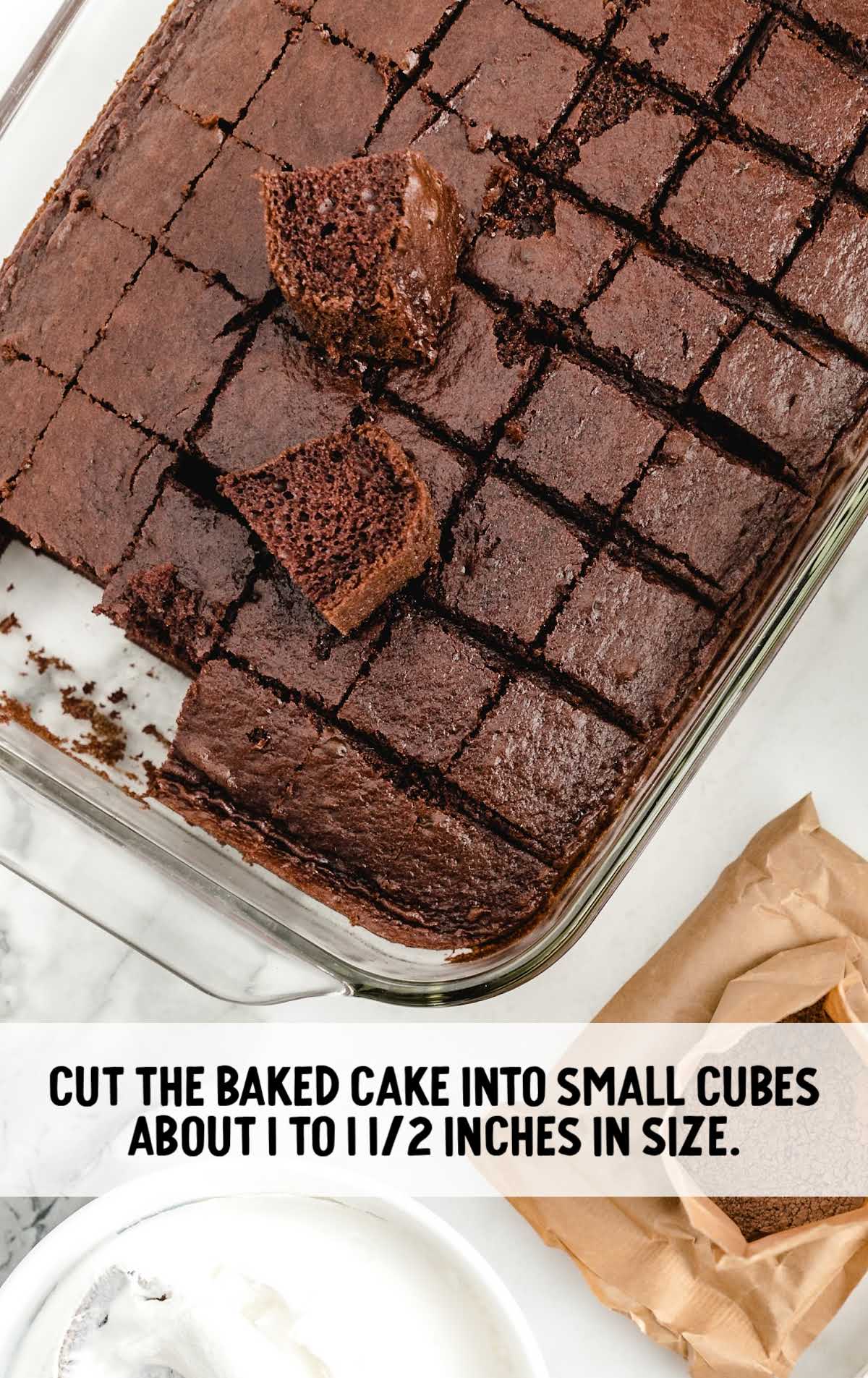 cake cut into small cubes in a baking dish