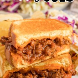 close up shot of Grilled Cheese Sloppy Joes served with chips and coleslaw on a plate