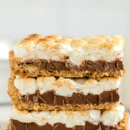 close up shot of s'mores bars stacked on top of eachother