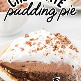 close up shot of a slice of chocolate pudding pie garnished with chocolate shavings on a plate with a fork