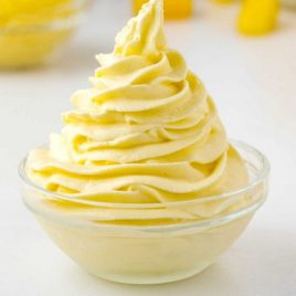 side shot of Dole Whip piped into a in a small clear bowl