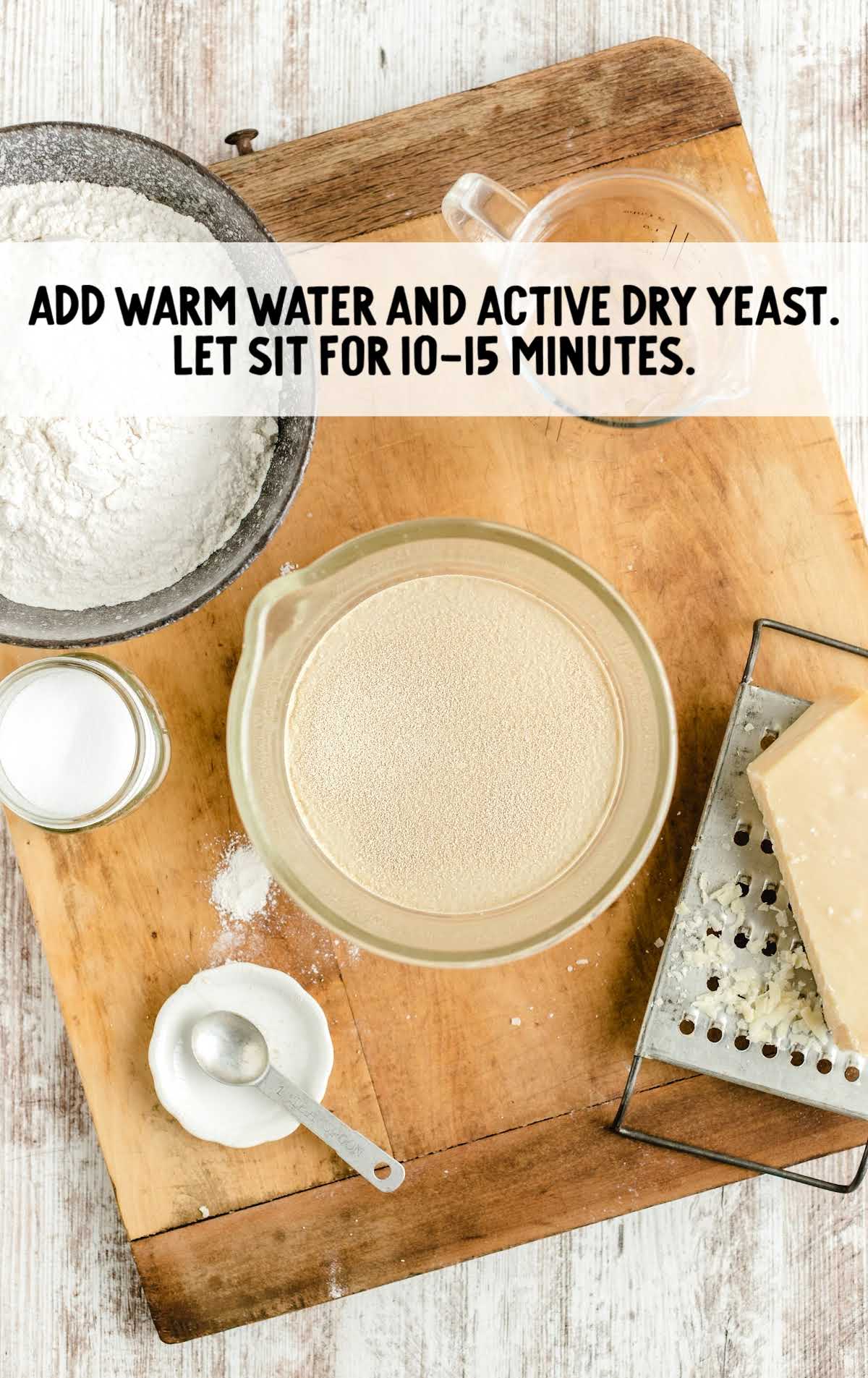 water and dry yeast in a measuring cup