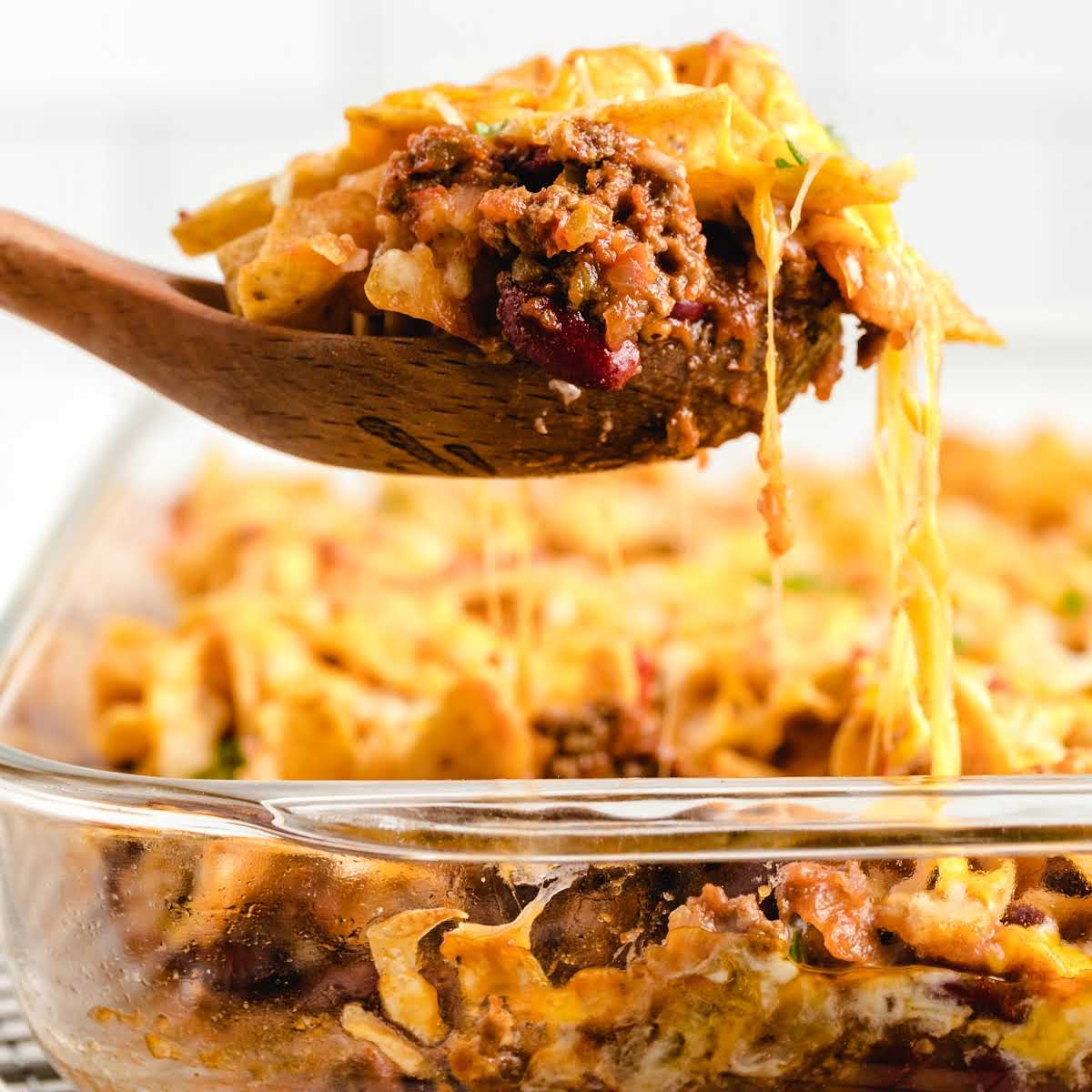 close up shot of a spoon with a piece of Frito Pie