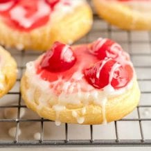close up shot of cherry danish on a cooling rack