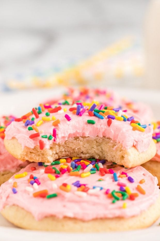 A close up of a piece of cake on a paper plate, with Cookie and Sugar