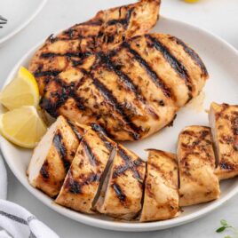 close up shot of sliced Grilled Chicken Breast on a plate