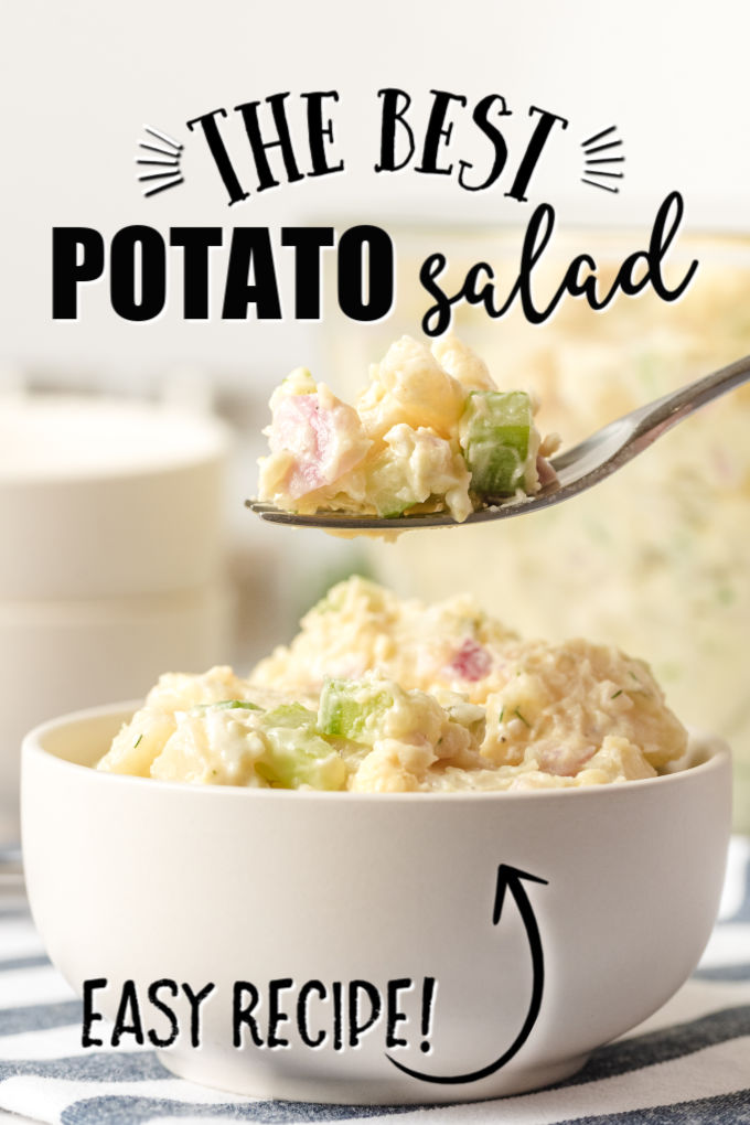 fork holding some potato salad over a spoon