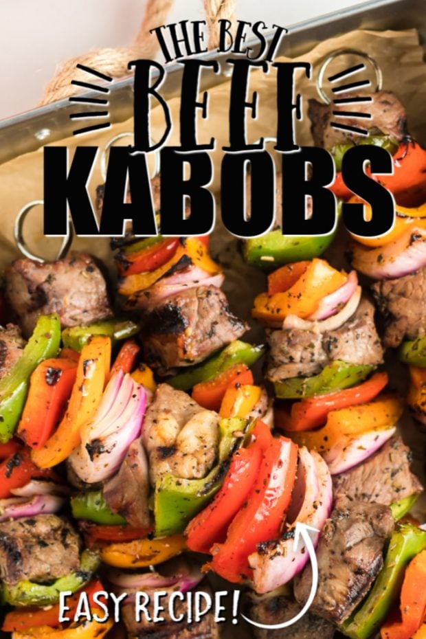 beef shish kabobs with veggies on skewers on a baking tray