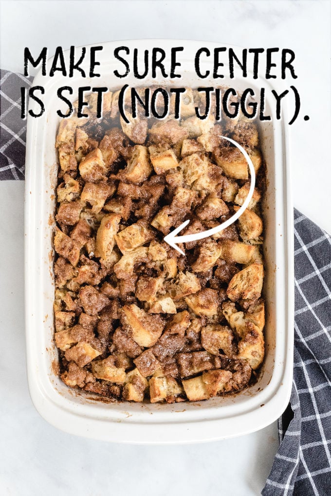A container with food in it, with Casserole and Bread