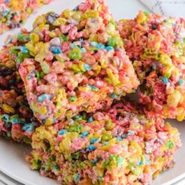 a bunch of Fruity Pebbles Treats on a plate