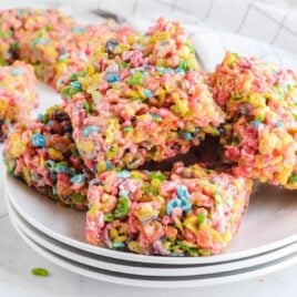 close up shot of a bunch of Fruity Pebbles Treats on a plate