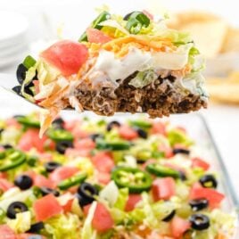 close up shot of a spoonful of Layered Taco Salad