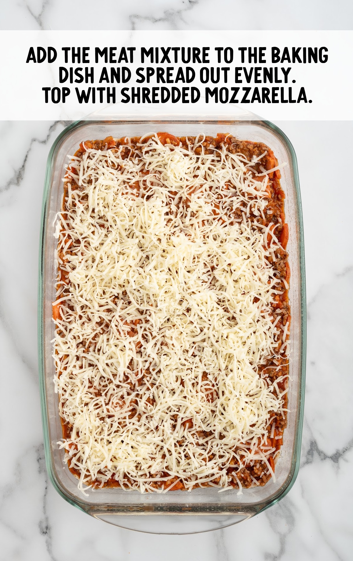 assembled upside down casserole with cheese on the top.