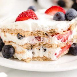 A close up of a piece of cake on a plate, with Berry and Icebox cake