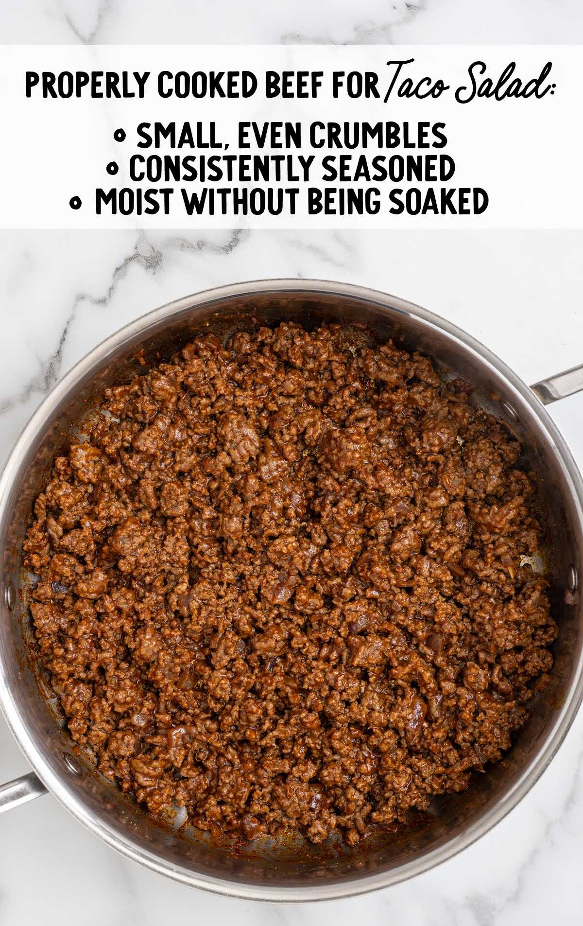 Properly cooked seasoned ground beef in skillet for taco salad with small even crumbles