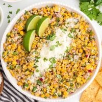 A bowl of food on a plate, with Salad
