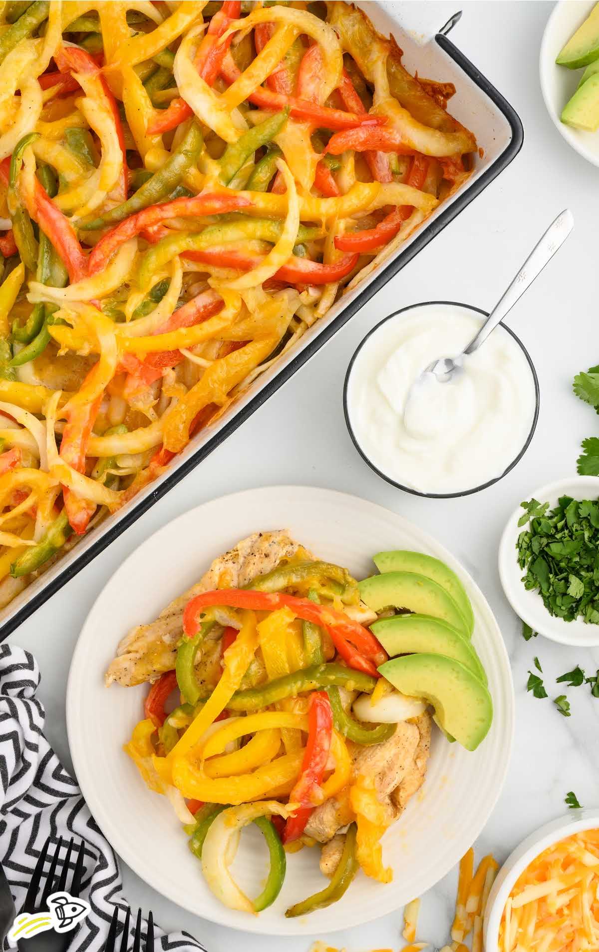 a plate of Chicken Fajita Casserole with avocado