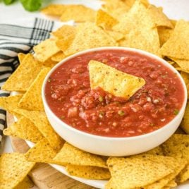 close up shot of a bowl of Salsa served with tortilla chips