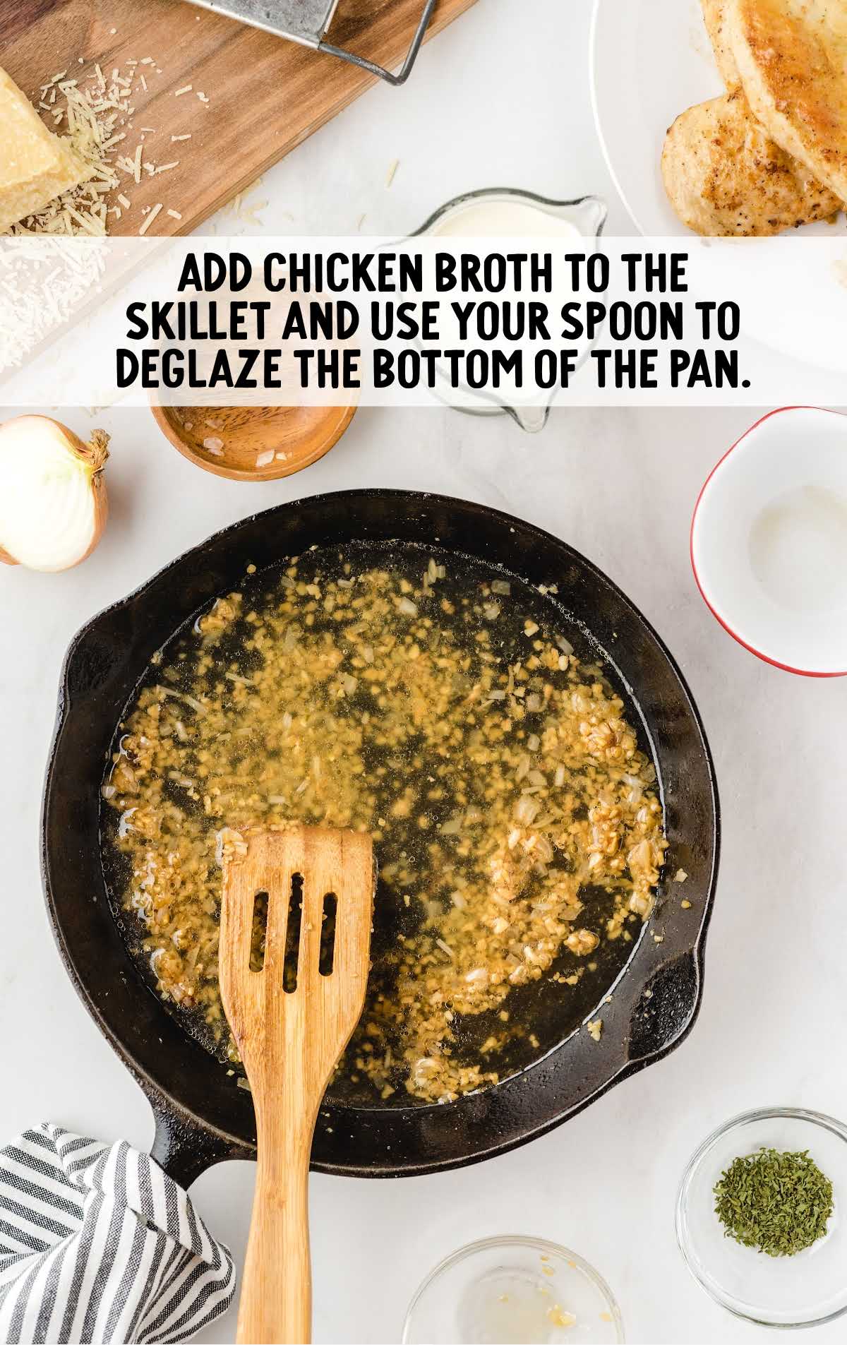 chicken broth added to the skillet