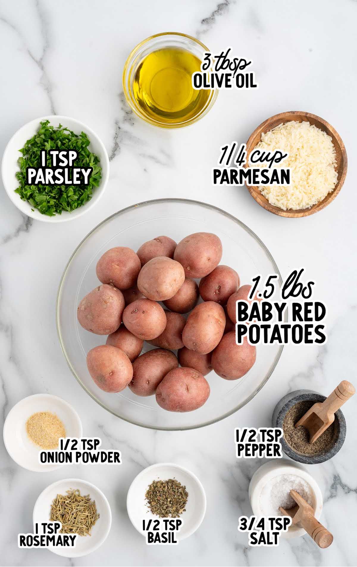 Labeled ingredients for grilled potatoes including baby red potatoes, olive oil, Parmesan, parsley, rosemary, basil, onion powder, salt, and pepper