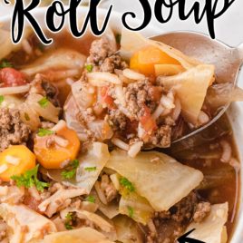 cabbage roll soup in a bowl with a spoon taking a bite and with text overlay