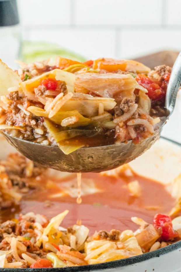 close up of cabbage roll soup in a ladle