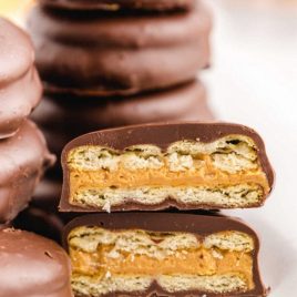 close up shot of Chocolate Peanut Butter Ritz Cookies stacked on top of each other showing their inside layers