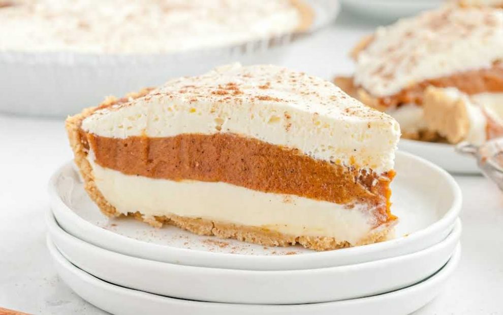 close up shot of a slice of No Bake Pumpkin Pie topped with cinnamon on a plate