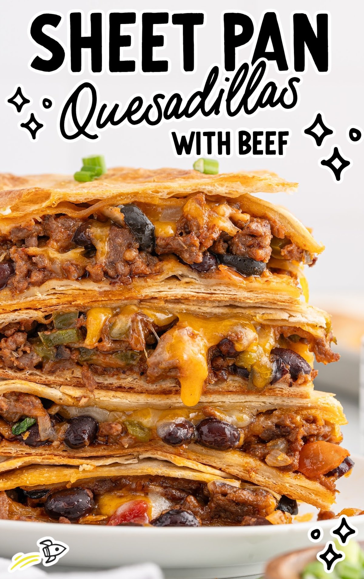 A stack of cheesy sheet pan quesadillas.