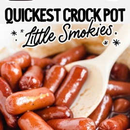 close up shot of bbq little smokies in a crockpot with a white spoon