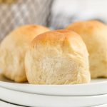 close up shot of dinner rolls on a white plate