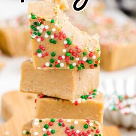 close up shot of Gingerbread Fudge with sprinkles stacked on top of each other on a wooden board
