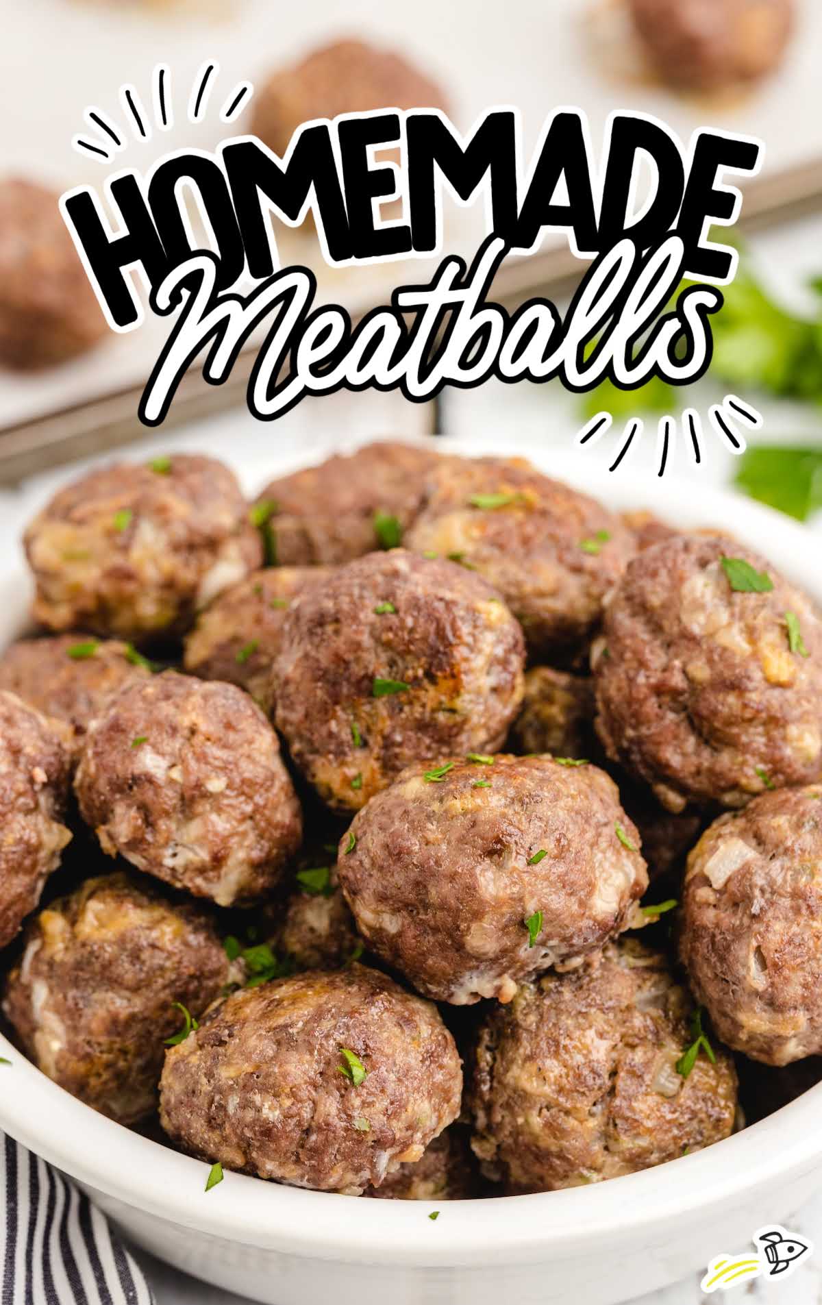 Bowl of freshly baked homemade meatballs garnished with parsley, with bold text overlay.