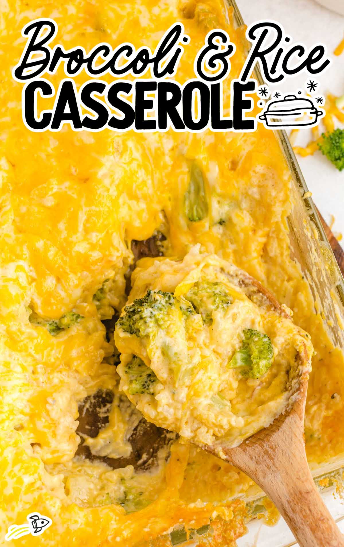 close up shot of broccoli and rice casserole on a wooden spoon