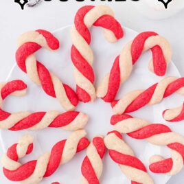 candy cane cookies on a white plate and surface