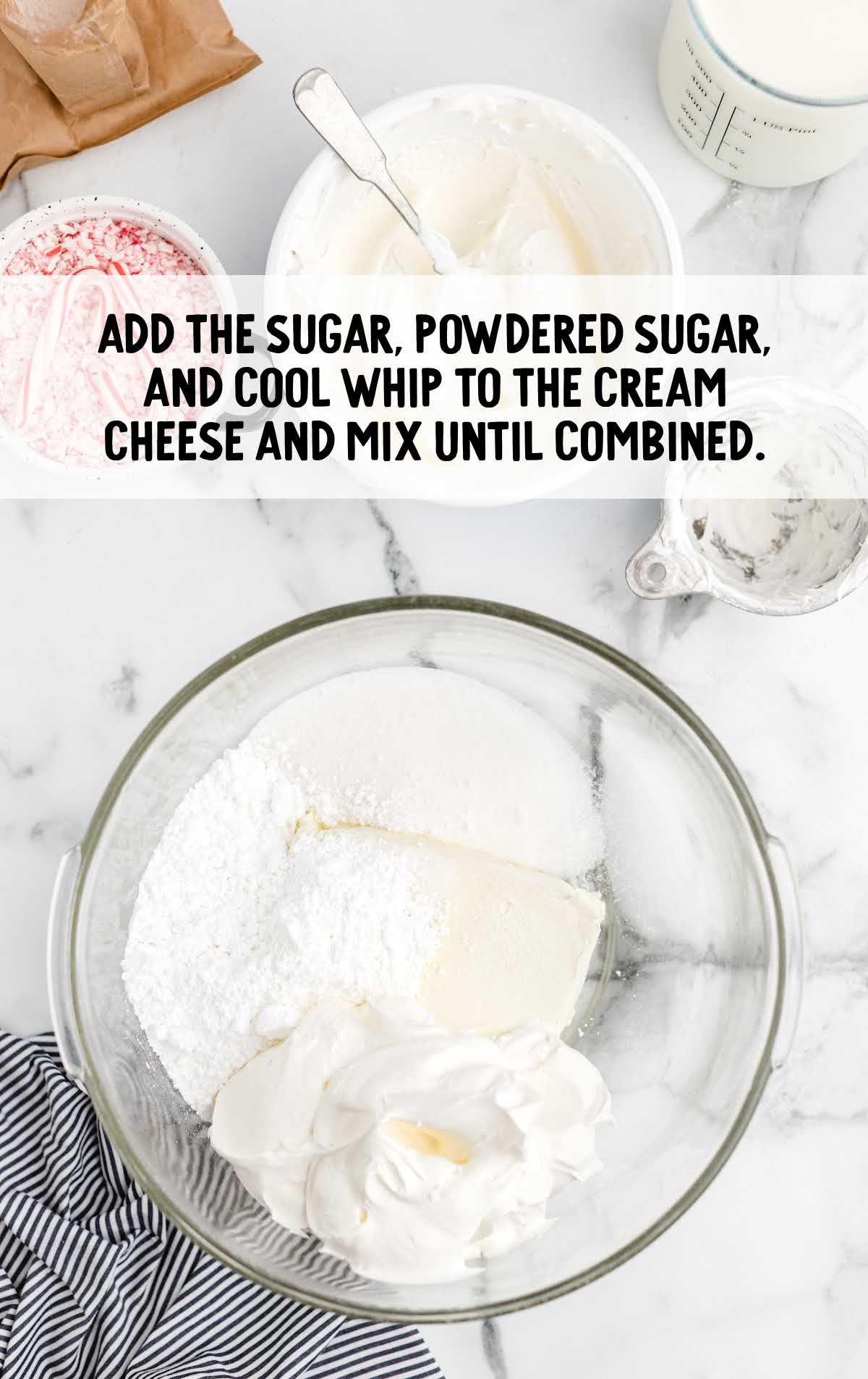 sugar, powdered sugar, and cool whip added to the cream cheese in a bowl