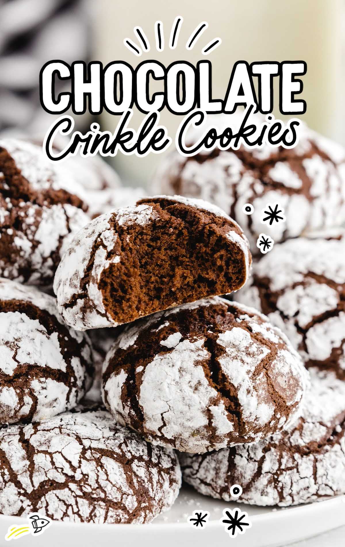Stacked chocolate crinkle cookies dusted with powdered sugar, with text overlay reading “Chocolate Crinkle Cookies.”